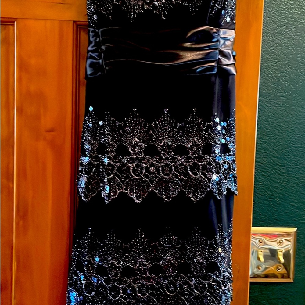 Sequined, detailed black party dress, new without tags.